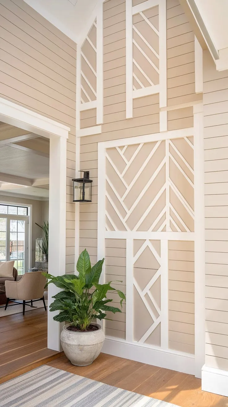 An accent entryway wall, featuring a stunning board and batten design in beige and white, instantly elevates this home entrance decor. The board and batten wall creates a welcoming atmosphere, perfectly complementing the house entrance and the cozy living space beyond.