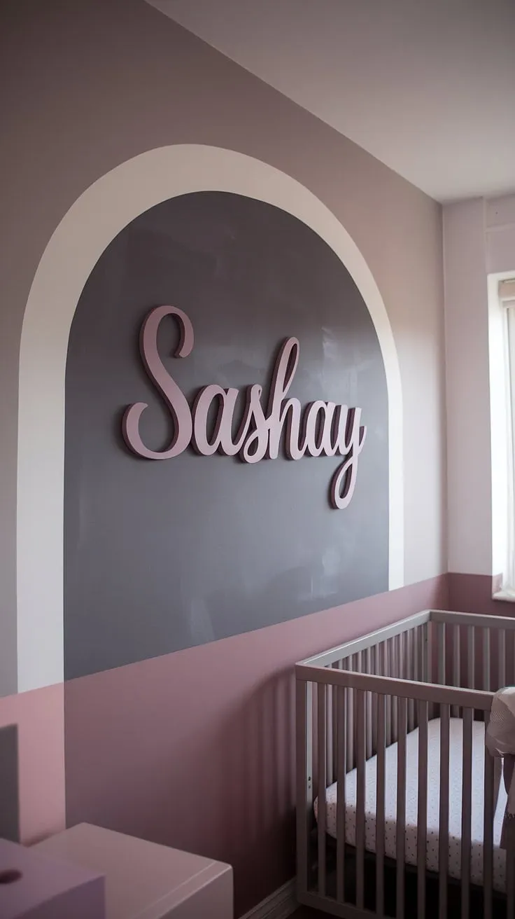 A dreamy grey and mauve nursery awaits little Sashay! This cinnamon slate nursery accent wall, painted in a Sherwin Williams Sashay sand-inspired shade, anchors the room's neutral palette.  The taupe and pink nursery features a crib on the window wall, creating a light and airy feel.  This light brown accent wall nursery is the perfect blend of modern minimalism and sweet girl nursery room wall decor.