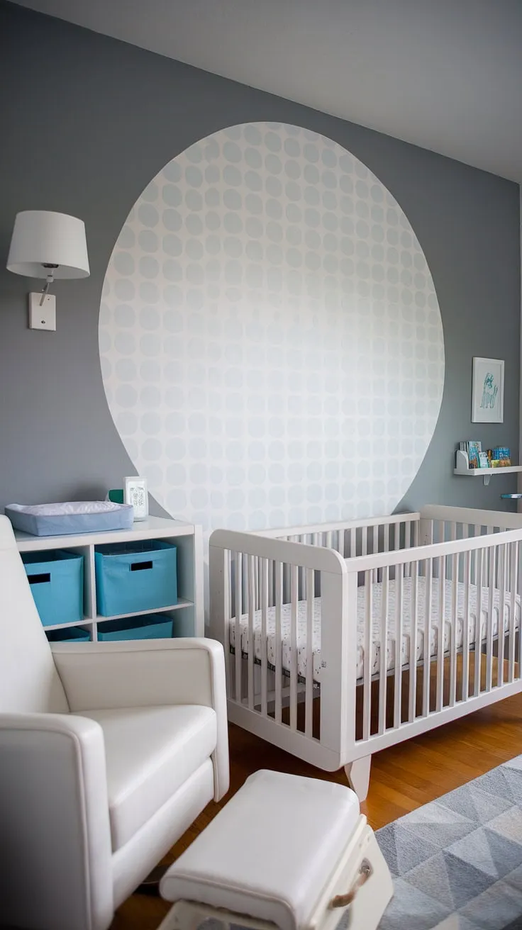 Dreamy nursery room design achieved! This baby boy room boasts a captivating accent nursery wall, transforming the space into a haven of calm.  The white-on-grey palette, complemented by soft blue accents, offers endless baby room inspiration and showcases beautiful baby room themes.  Get inspired by this baby nursery inspiration and create your own perfect nursery room. This baby room design is the ultimate nursery inspo for a peaceful and stylish baby boy nursery.