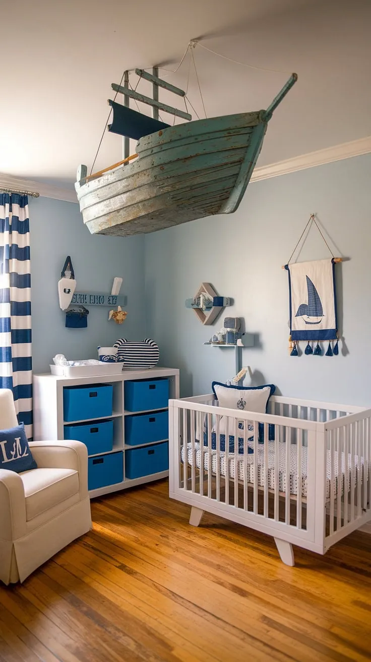 Dive into this dreamy baby boy nursery!  The light blue walls and nautical accents create a serene and stylish baby room design.  From the ship hanging above the crib to the carefully chosen baby room themes, this nursery room design is brimming with baby room inspiration.  Get your nursery inspo fix with this perfect example of a baby boy room and accent nursery wall.