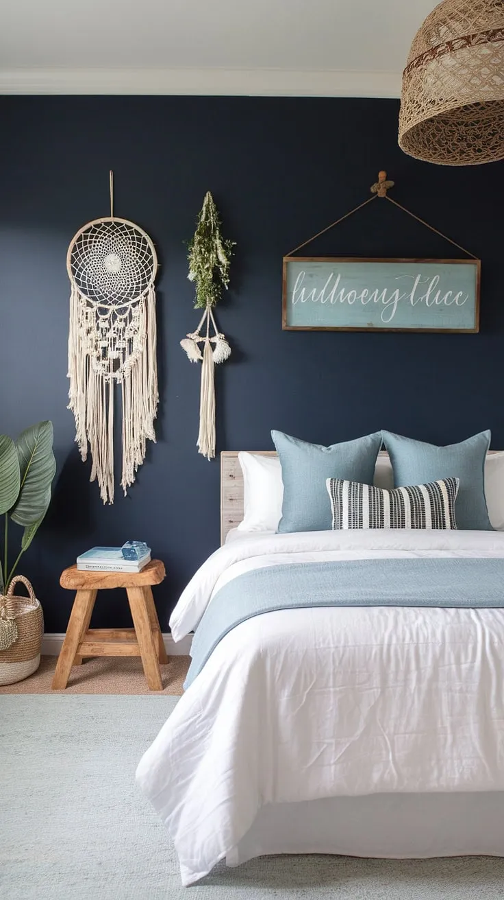 This boho farmhouse bedroom is a sanctuary of coastal calm. The navy blue walls, adorned with a dreamcatcher and wooden sign, perfectly complement the light blue rug and white bedding. The addition of a wooden stool and blue accent pillows completes this tranquil escape.