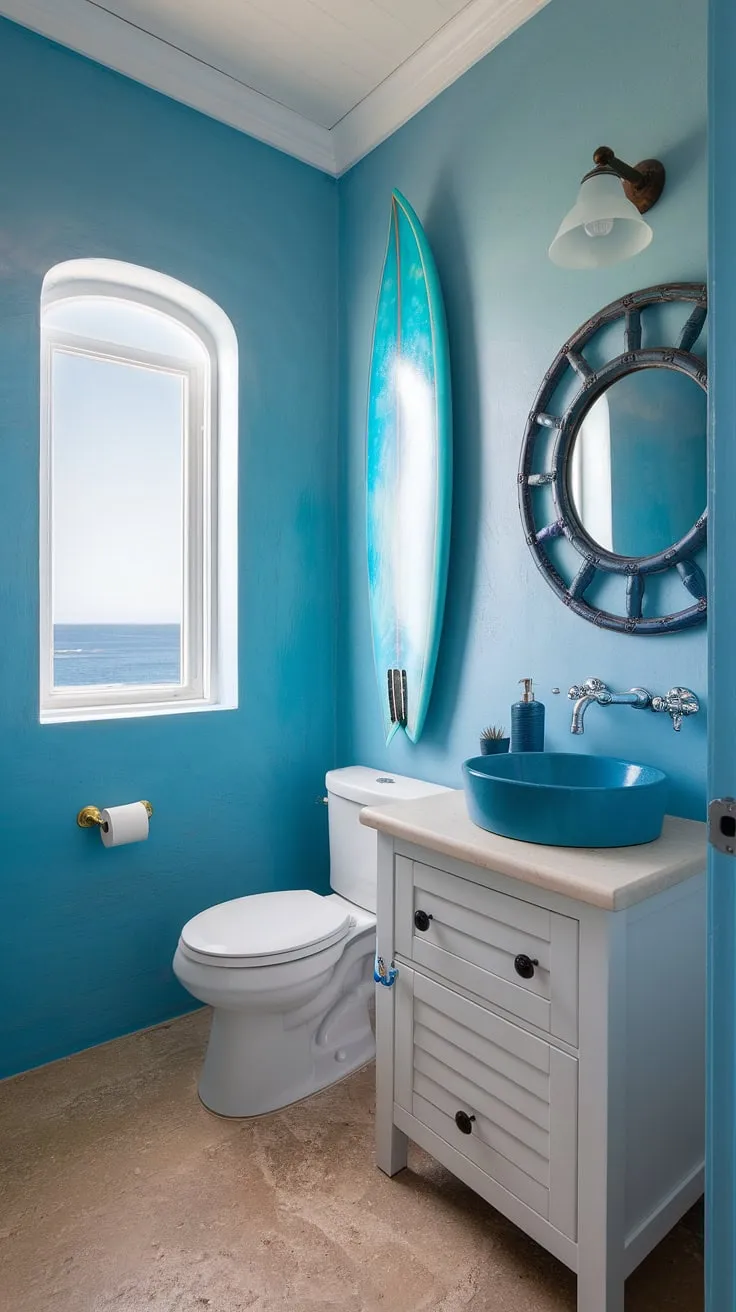 Escape to the coast every morning in this serene coastal small bathroom.  The perfect blend of blue beach bathroom ideas and white coastal bathroom ideas creates a calming coastal aesthetic bathroom, embodying the relaxed beach house bathroom aesthetic.  This beach aesthetic bathroom design, with its subtle surf theme bathroom touches, is the epitome of beach cottage style bathroom charm.