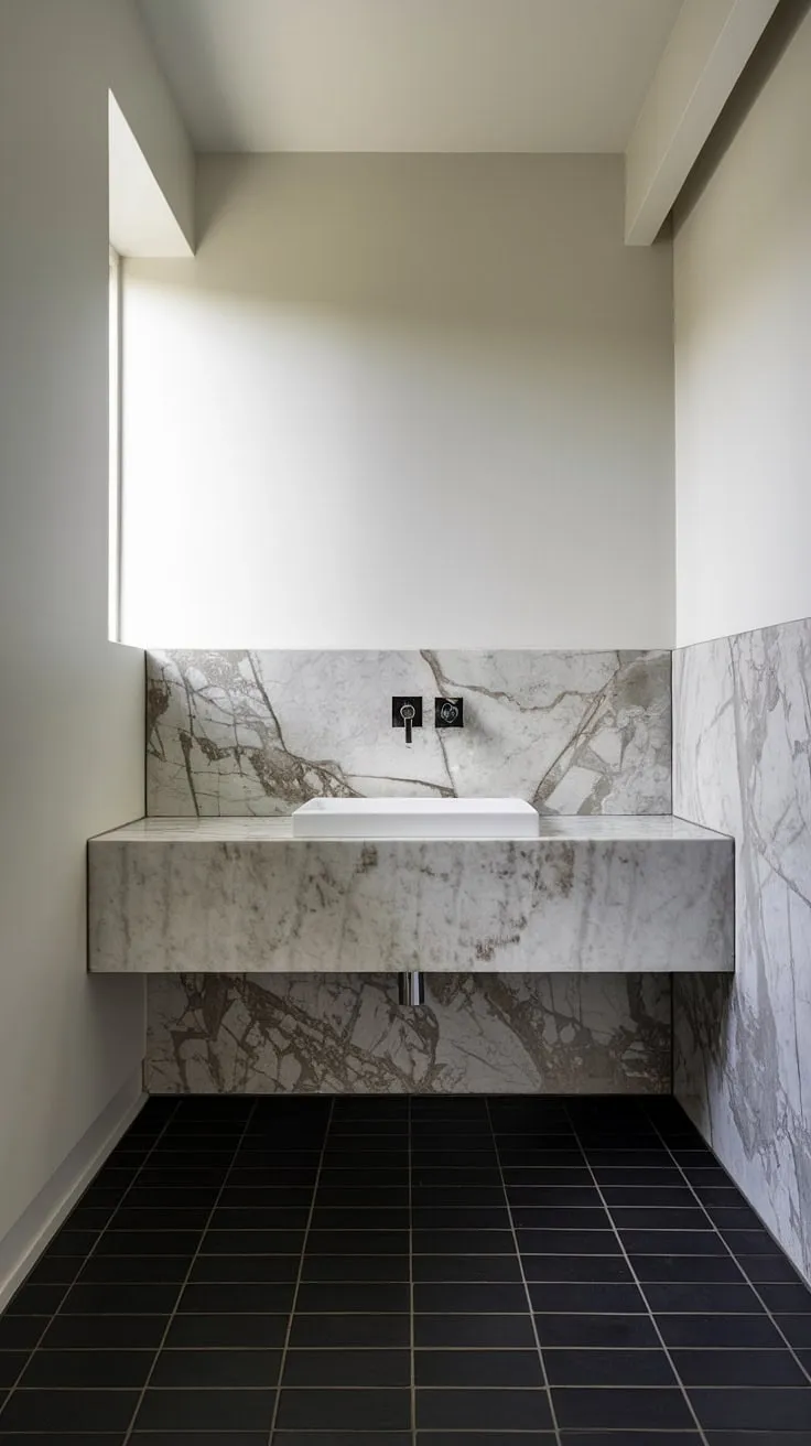 Experience the refined elegance of this ultra-modern powder room.  The minimalist bathroom vanity is a statement piece within this luxury powder room, perfectly embodying contemporary powder room and modern powder room design principles.  Discover inspiring powder room interior design at its finest.