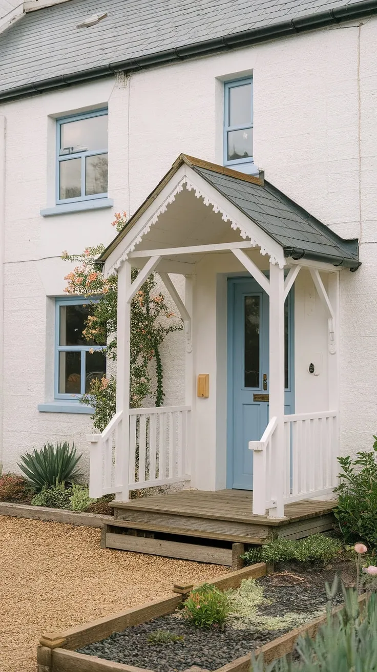 Step into charm with this inviting cottage front entrance, showcasing delightful cottage porch ideas and a beautifully landscaped cottage front garden.  The cottage facade ideas are perfectly complemented by the cottage front door and veranda, creating a picturesque scene.