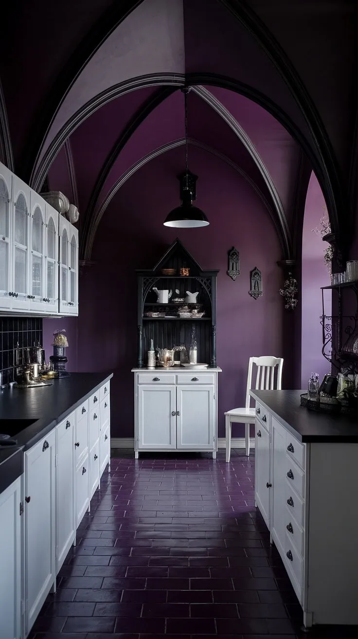 Where shadows dance and secrets whisper, this gothic kitchen, with its dark purple hues and stark white cabinetry, offers a sanctuary of mysterious allure. The pointed arches and black countertop add to the dramatic ambiance, creating a space both elegant and undeniably captivating. A perfect blend of darkness and feminine grace.