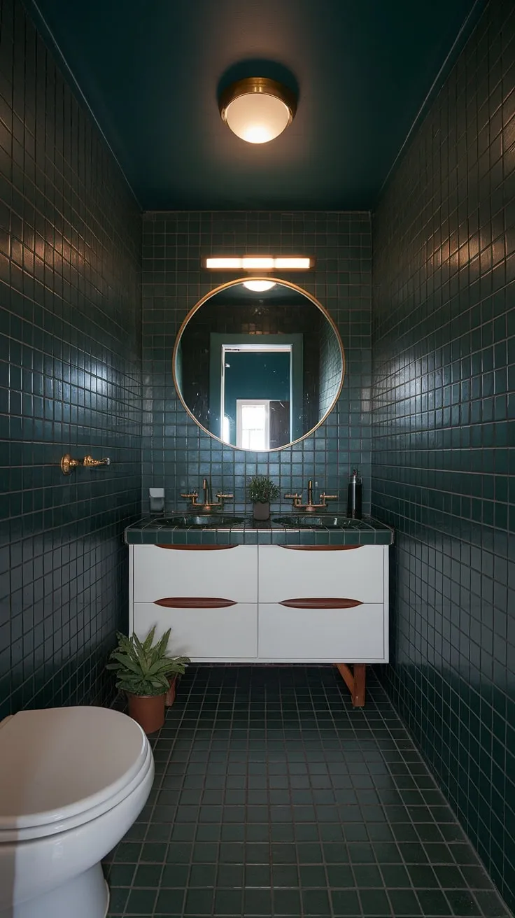 Step into a sanctuary of sophisticated style. This mid-century modern bathroom, with its dark green tile, gold accents, and a double vanity, is a testament to timeless design. The circular mirror and subtle plant add a touch of unexpected warmth. A perfectly curated space for quiet contemplation.