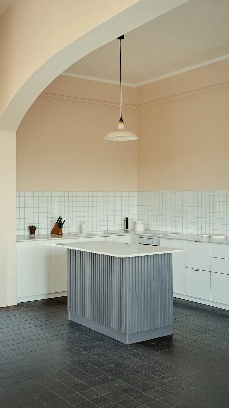 Clean lines and calming neutrals define this minimalist kitchen. The grey island provides a sophisticated contrast against the white cabinetry, creating a space that's both stylish and functional. A perfect example of modern design at its finest.