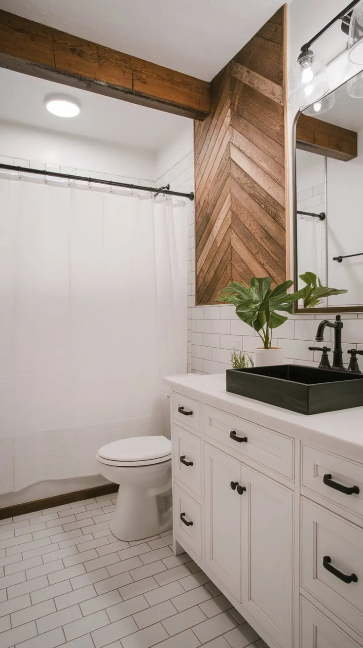 Clean lines and contrasting textures define this modern farmhouse bathroom, where a white vanity and black sink create a stylish focal point.