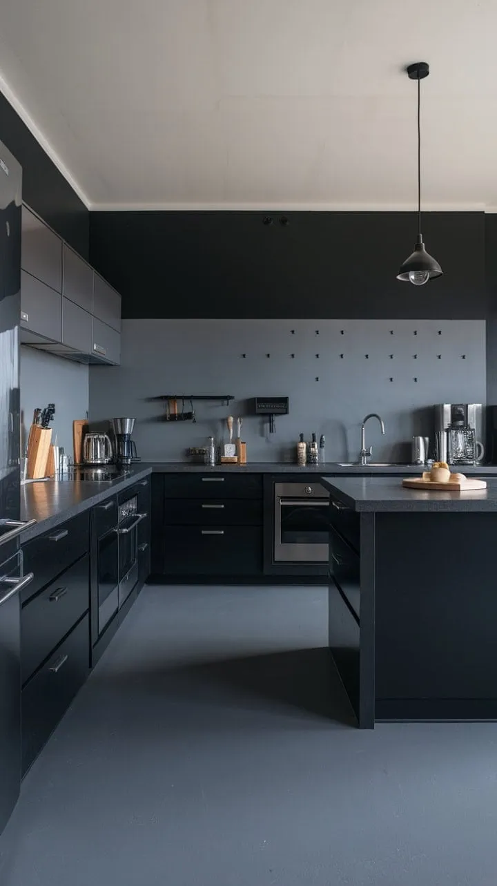 This dark kitchen blends sleek minimalism with industrial charm, featuring a striking grey and black palette, stainless steel accents, and clever organizational details for a uniquely functional space.