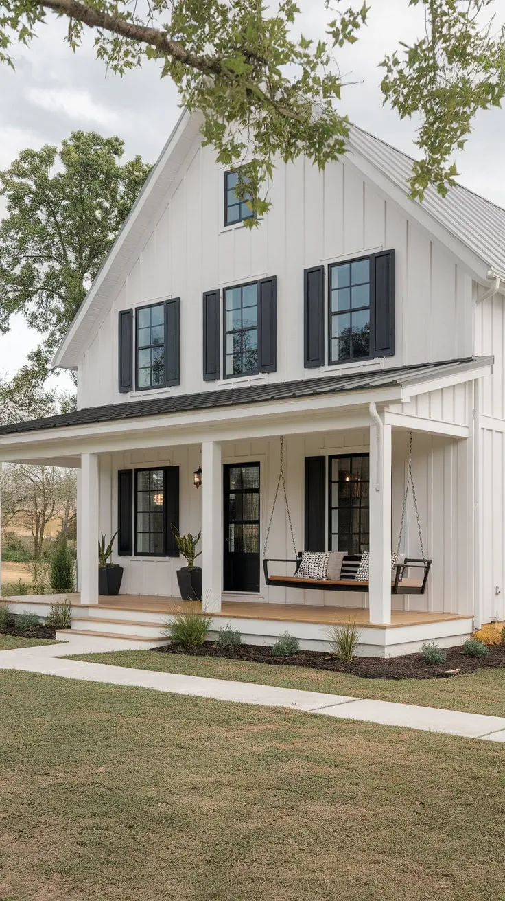 Stylish White Farmhouse Featuring a Cozy Porch Swing
