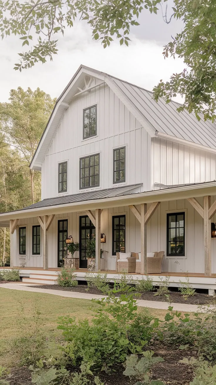 The white farmhouse with shutters and a barn-style design, complemented by black and wood accents, showcases stunning house exterior aesthetics ideal for remodeling the front of a home.