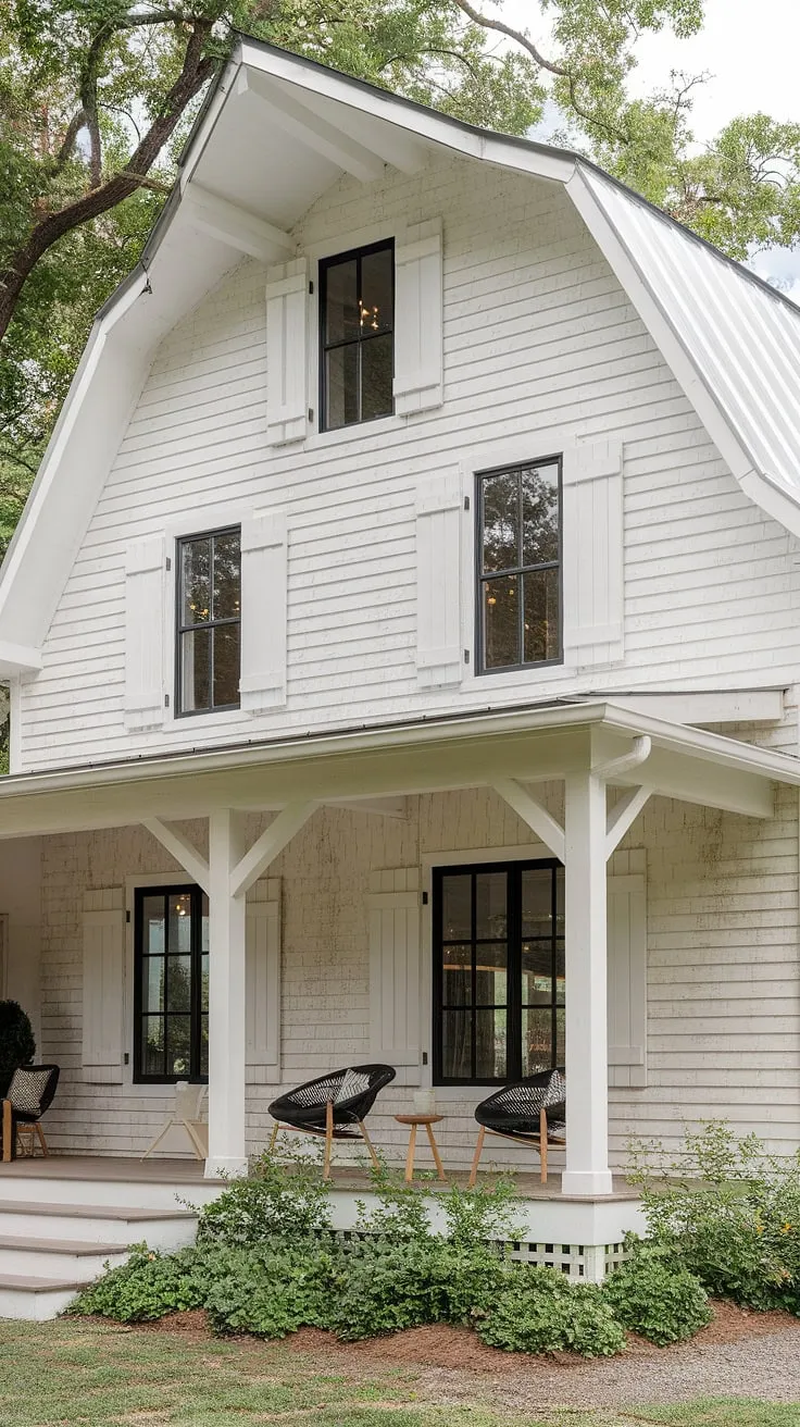 This modern farmhouse features an L-shaped porch, a white rustic exterior with black windows and wood accents, and charming white shutters, creating a stunning house exterior aesthetic perfect for small farmhouse exterior ideas.