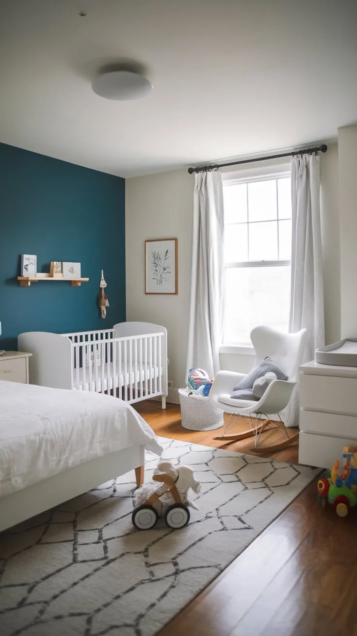 A stylish white guest room cleverly incorporates a nursery, creating a harmonious space for both parents and baby with a light and airy feel.