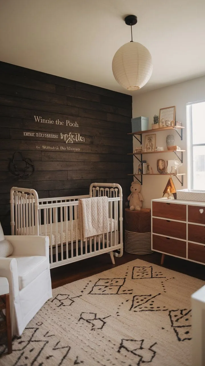 This nursery beautifully marries modern comfort with vintage charm, highlighted by a dark wood accent wall adorned with a whimsical Winnie the Pooh quote.