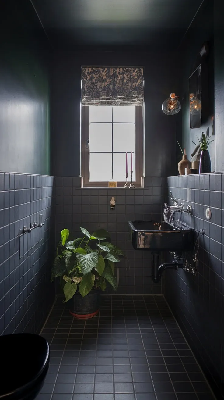This moody bathroom features dark walls, a black sink, and soft lighting, creating an inviting atmosphere perfect for a stylish bathroom remodel.