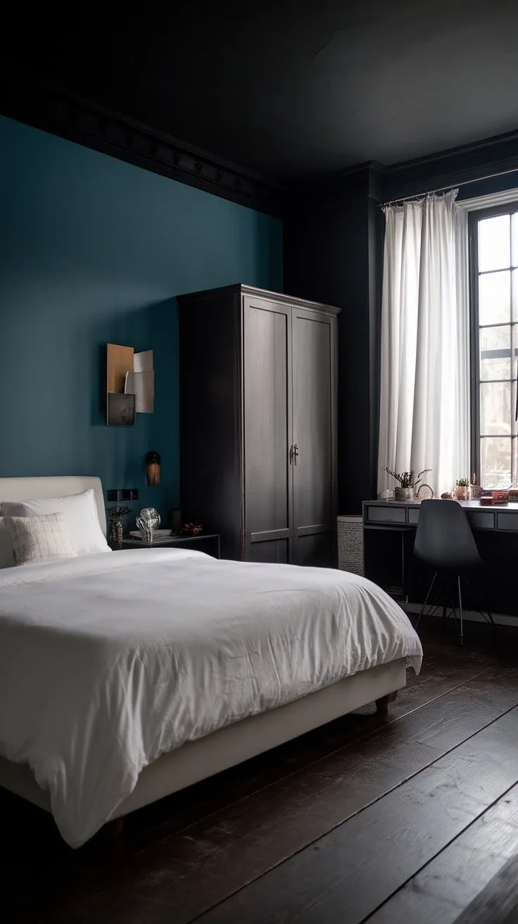 The combination of a white bed, dark walls, and a blue accent wall in this modern bedroom creates a cozy and inviting atmosphere ideal for relaxing blue bedroom ideas.