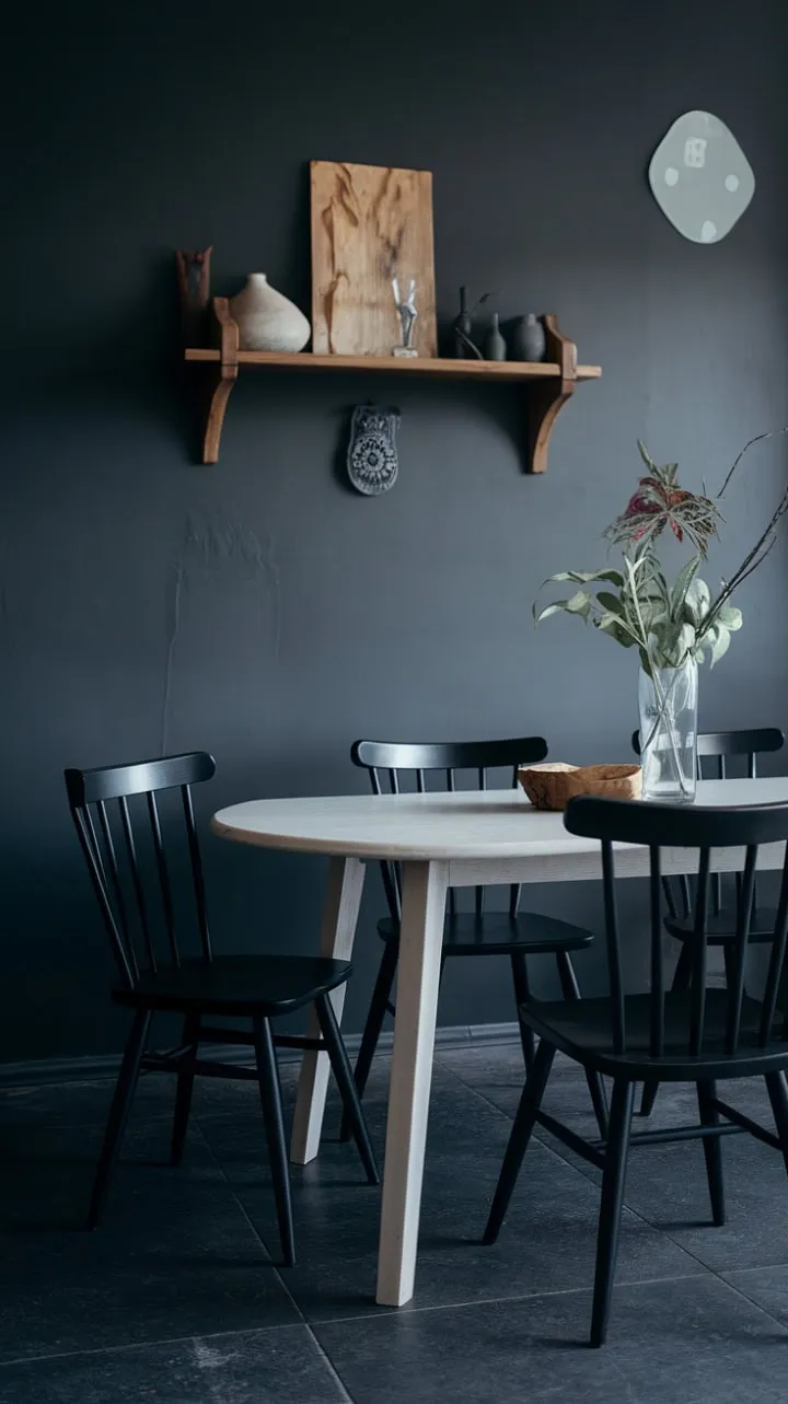 This Scandinavian dining space exudes sophisticated calm with its cool gray tones, clean lines, and a minimalist blend of white, black, and dark gray elements.