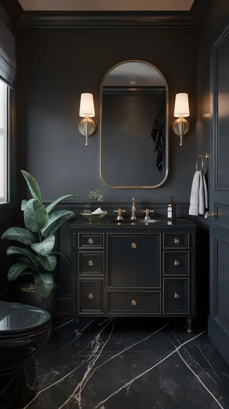 The black powder room exudes luxury with its marble flooring, gold accents, and moody decor, making it an ideal powder bathroom for those who appreciate sophisticated design.