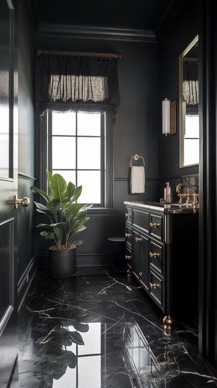 The black powder room exudes luxury with its moody ambiance, marble floor, and gold accents, making it a stunning example of dark bathrooms.