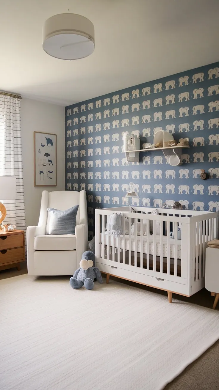 Serene and stylish, this nursery room guest room combo seamlessly blends functionality and charm.  The minimalist baby boy nursery design, featuring a calming blue elephant wallpaper and thoughtful nursery decor, offers a peaceful retreat for both baby and guests.  This space showcases clever baby room ideas and reflects current nursery trends, making it a perfect example of modern nursery aesthetics.